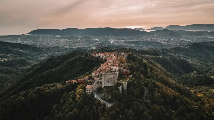 an aerial view of a castle on a hill